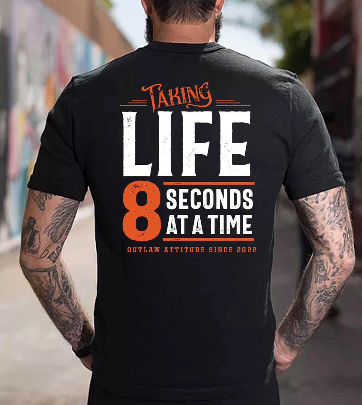 Back view of the black "Taking Life 8 Seconds at a Time" T-Shirt