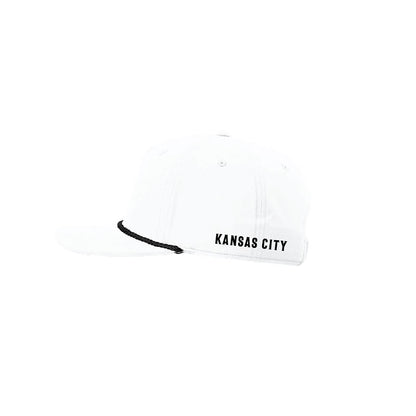 Side of a white cap with 'Kansas City' text on a white background